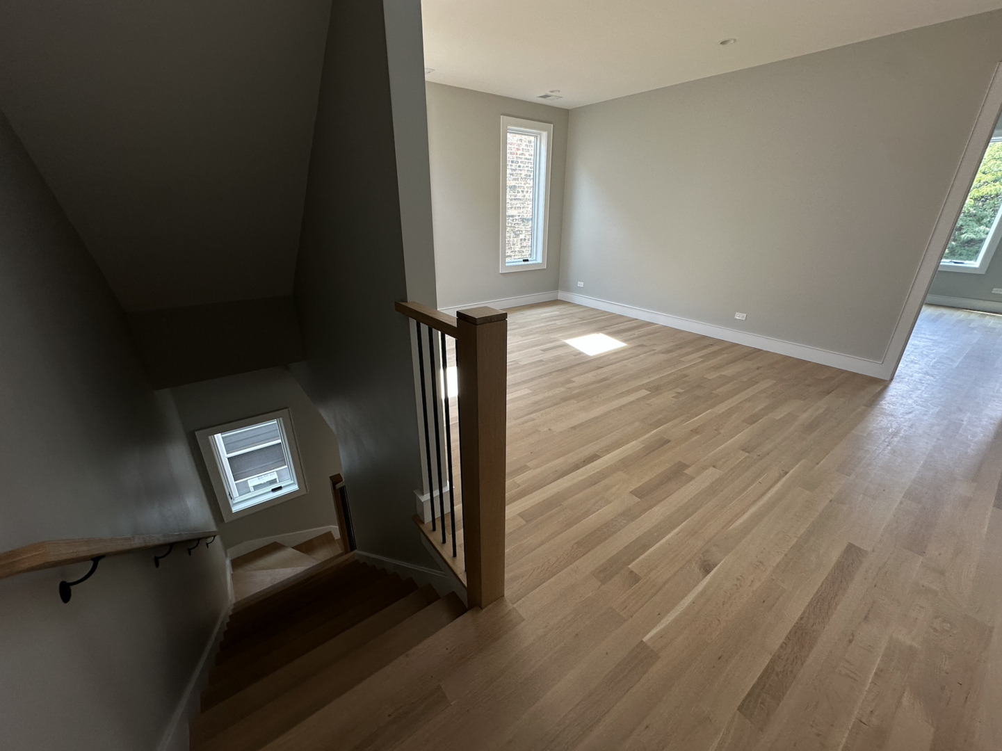 4243 North Damen Avenue, Unit 1F Chicago, IL 60618 - Photo 14 of 42 wooden floor in an empty room with a window