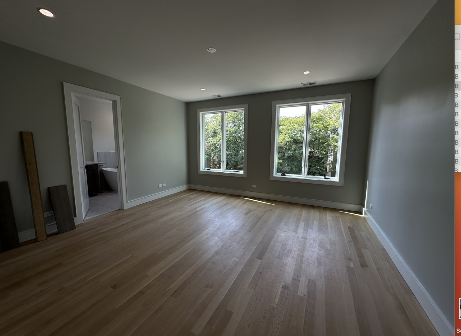 4243 North Damen Avenue, Unit 1F Chicago, IL 60618 - Photo 19 of 42 a view of an empty room with wooden floor and a window