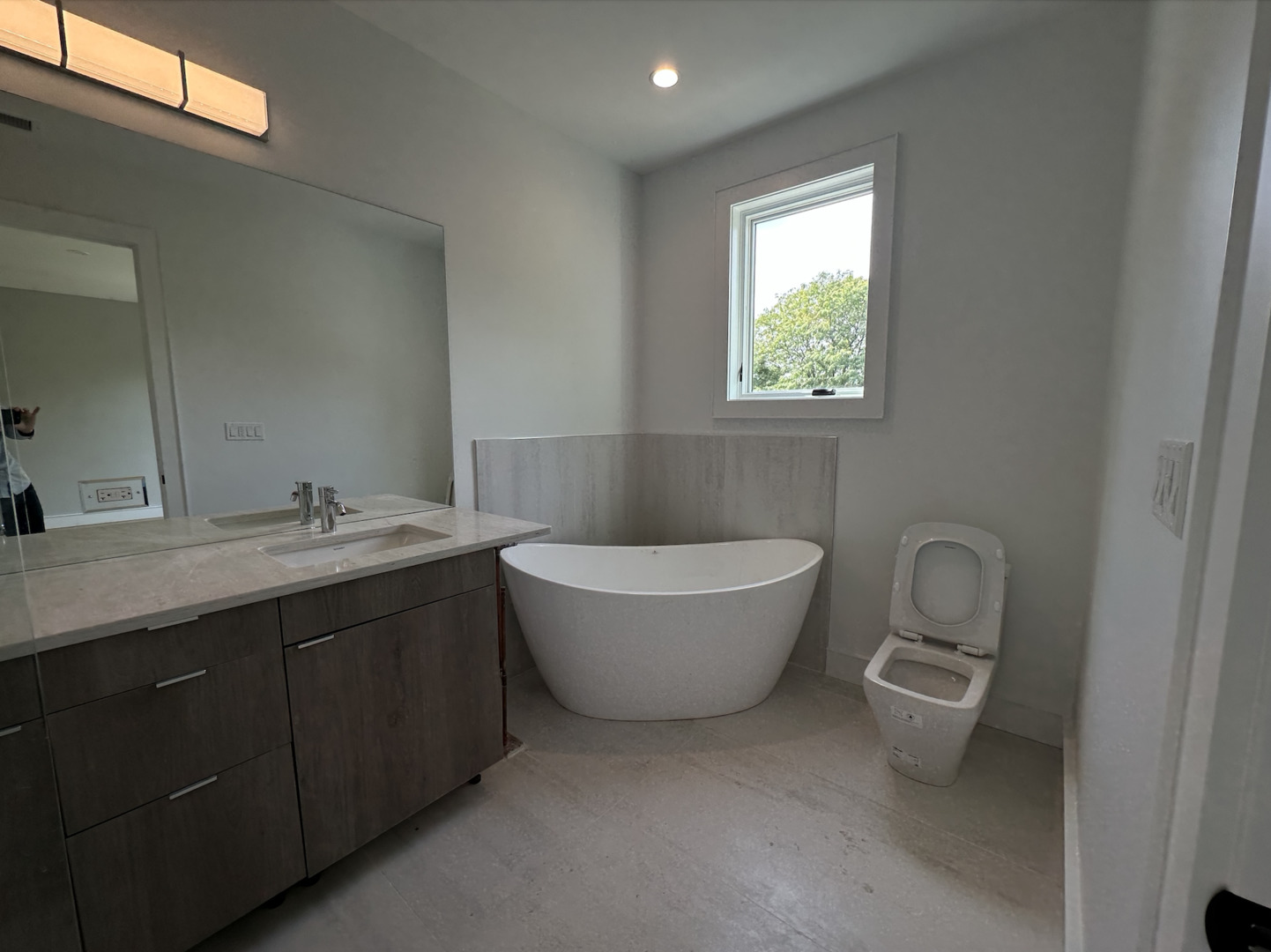 4243 North Damen Avenue, Unit 1F Chicago, IL 60618 - Photo 20 of 42 a bathroom with a granite countertop sink a toilet and mirror