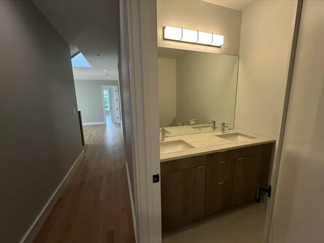 a bathroom with a sink and mirror