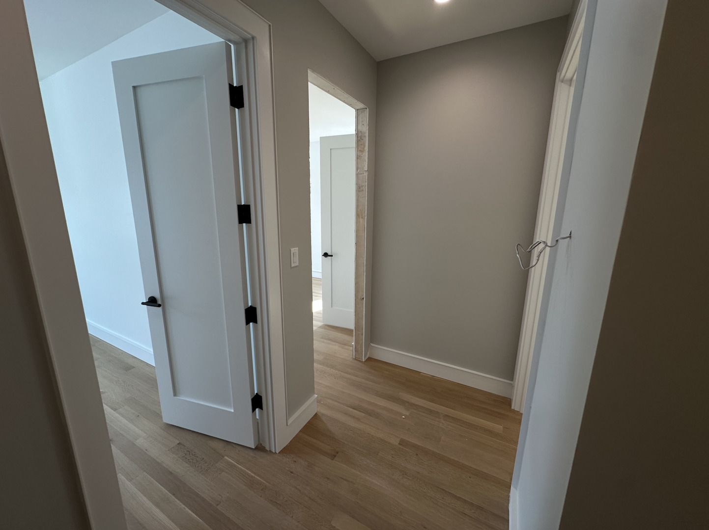 4243 North Damen Avenue, Unit 1F Chicago, IL 60618 - Photo 26 of 42 a view of a hallway with wooden floor
