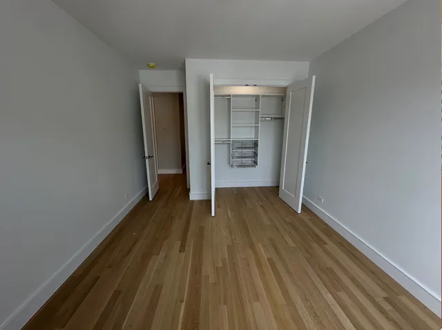 a view of wooden floor in an empty room