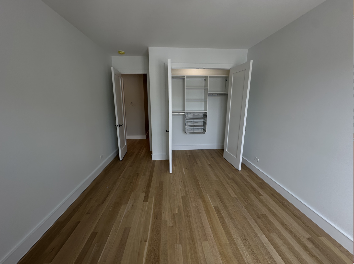 4243 North Damen Avenue, Unit 1F Chicago, IL 60618 - Photo 28 of 42 a view of wooden floor in an empty room