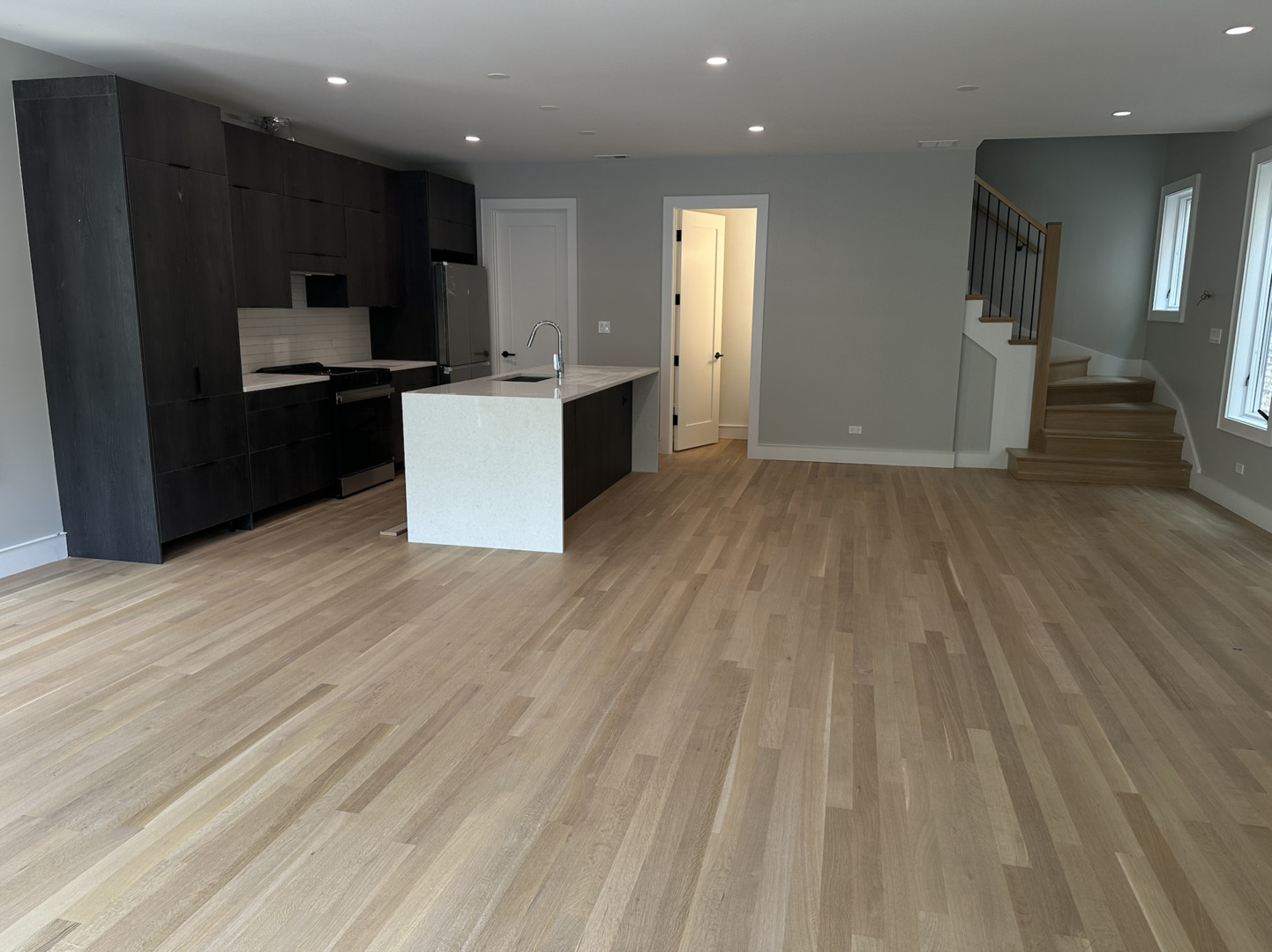 4243 North Damen Avenue, Unit 1F Chicago, IL 60618 - Photo 5 of 42 a kitchen with stainless steel appliances granite countertop a refrigerator and a stove top oven