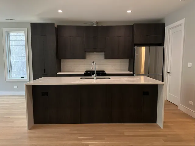 a close view of kitchen with granite countertop
