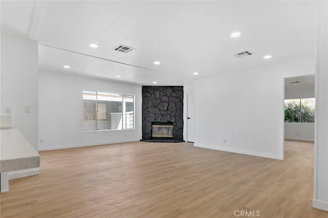 a kitchen with a sink stainless steel appliances and cabinets