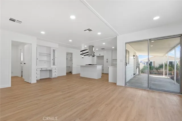a view of cabinets and wooden floor