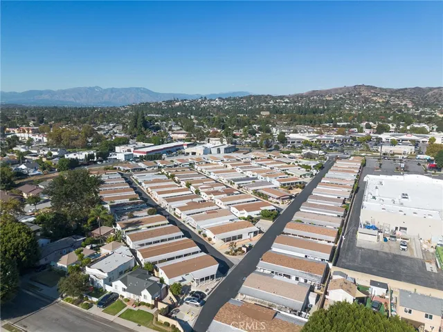 an aerial view of a house with outdoor space