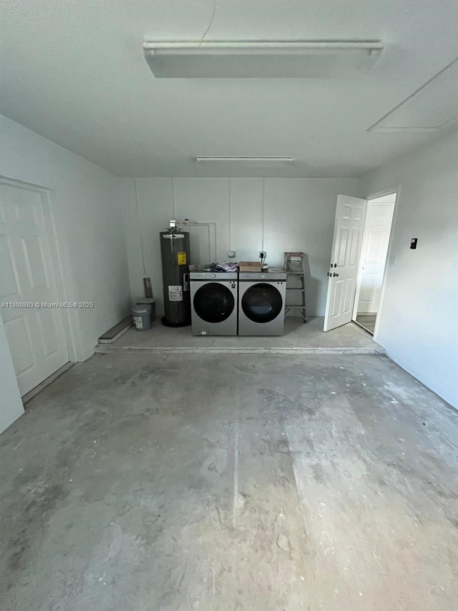 5218 Southeast 43rd Street Okeechobee, FL 34974 - Photo 13 of 20 a view of a storage & utility room with a washing machine