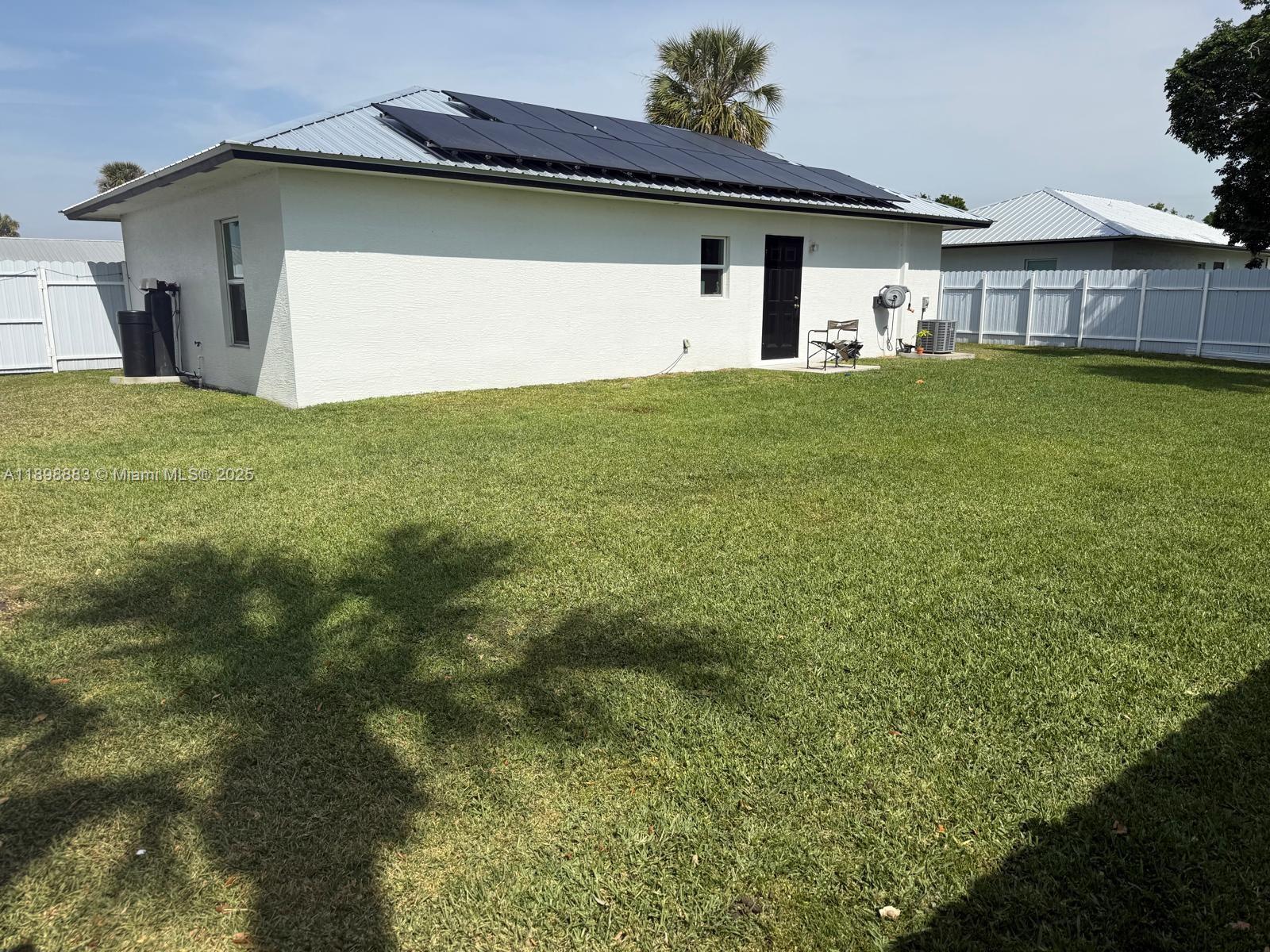 5218 Southeast 43rd Street Okeechobee, FL 34974 - Photo 17 of 20 a view of a house with a yard