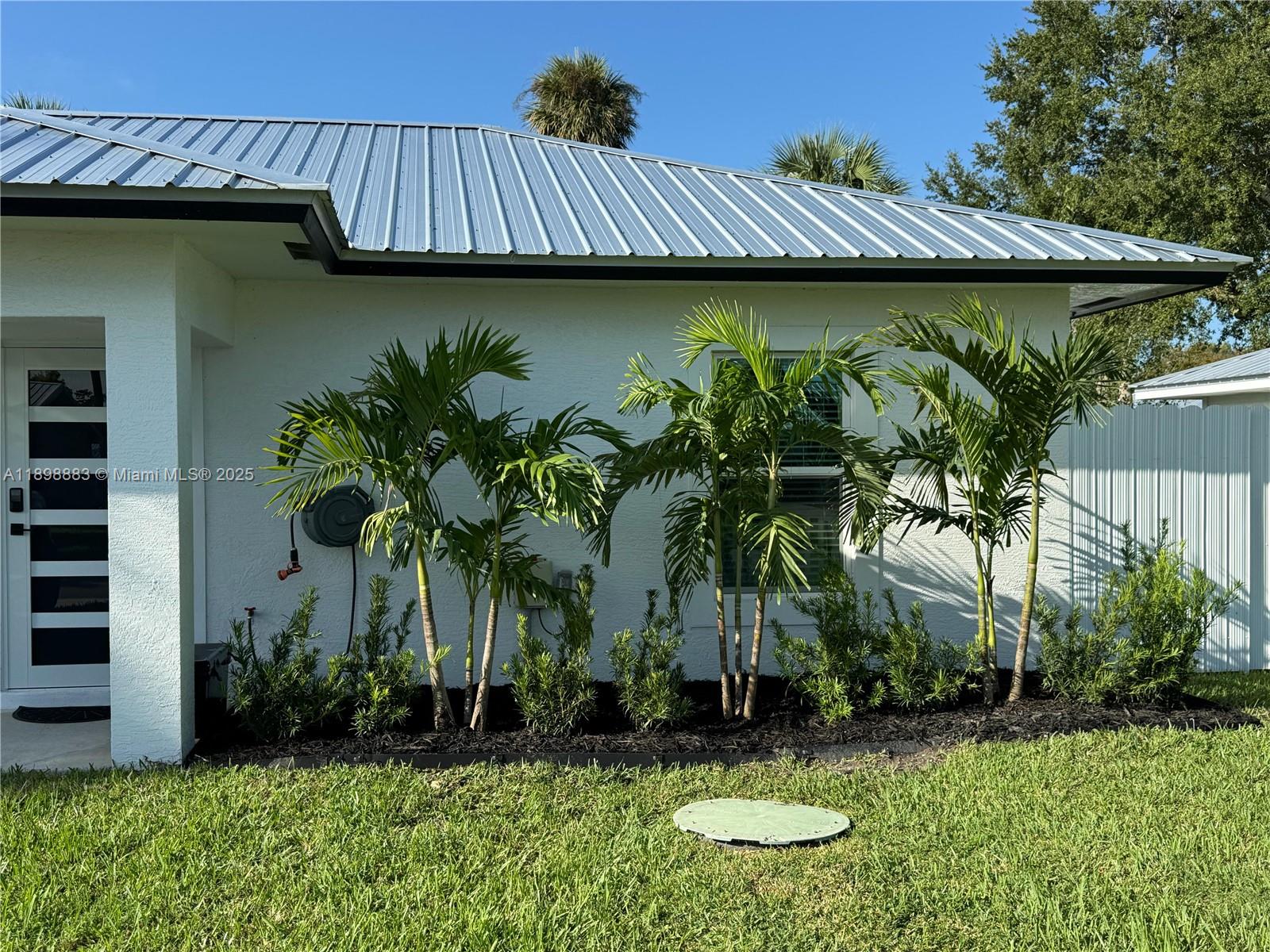 5218 Southeast 43rd Street Okeechobee, FL 34974 - Photo 19 of 20 a view of a backyard with plants