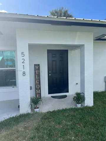 a view of a living room with wooden floor