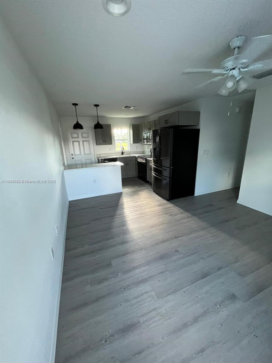 5218 Southeast 43rd Street Okeechobee, FL 34974 - Photo 7 of 20 a view of a living room with wooden floor