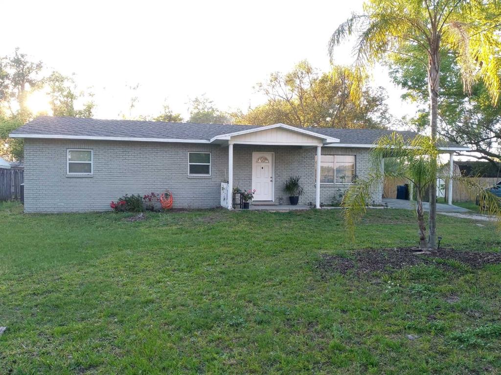 2403 Fritzke Road Dover, FL 33527 - Photo 1 of 1 a front view of house with yard and green space