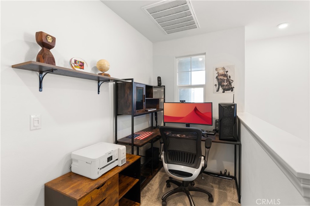 904 Maya Crossing, Unit 19 Lake Elsinore, CA 92530 - Photo 11 of 25 a room with furniture and a window