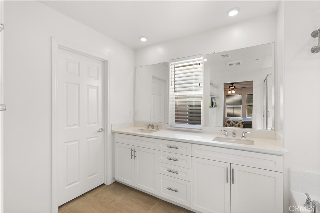 904 Maya Crossing, Unit 19 Lake Elsinore, CA 92530 - Photo 15 of 25 a bathroom with a sink and a window