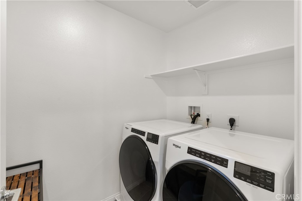 904 Maya Crossing, Unit 19 Lake Elsinore, CA 92530 - Photo 21 of 25 a utility room with dryer and washer