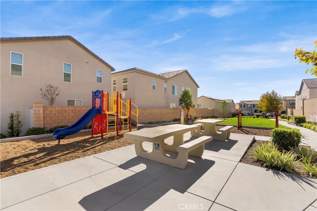 904 Maya Crossing, Unit 19 Lake Elsinore, CA 92530 - Photo 23 of 25 a view of a house with backyard