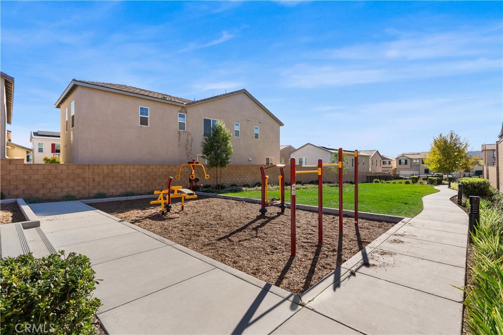 904 Maya Crossing, Unit 19 Lake Elsinore, CA 92530 - Photo 24 of 25 a view of a backyard with a garden