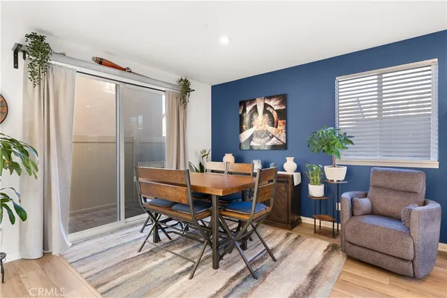 a view of a livingroom with furniture and a potted plant
