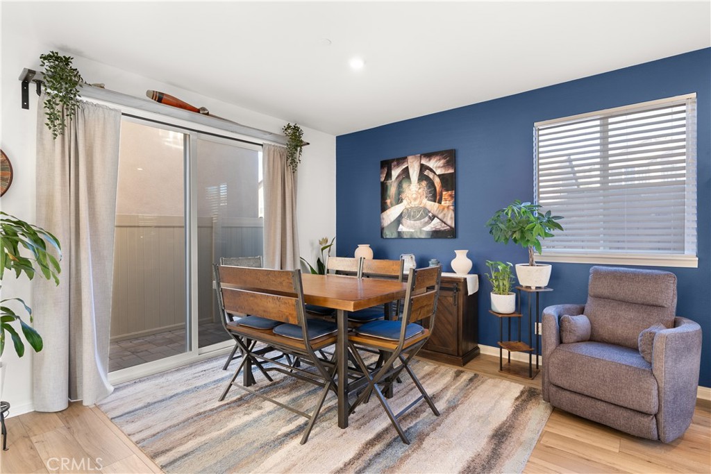 904 Maya Crossing, Unit 19 Lake Elsinore, CA 92530 - Photo 7 of 25 a view of a livingroom with furniture and a potted plant