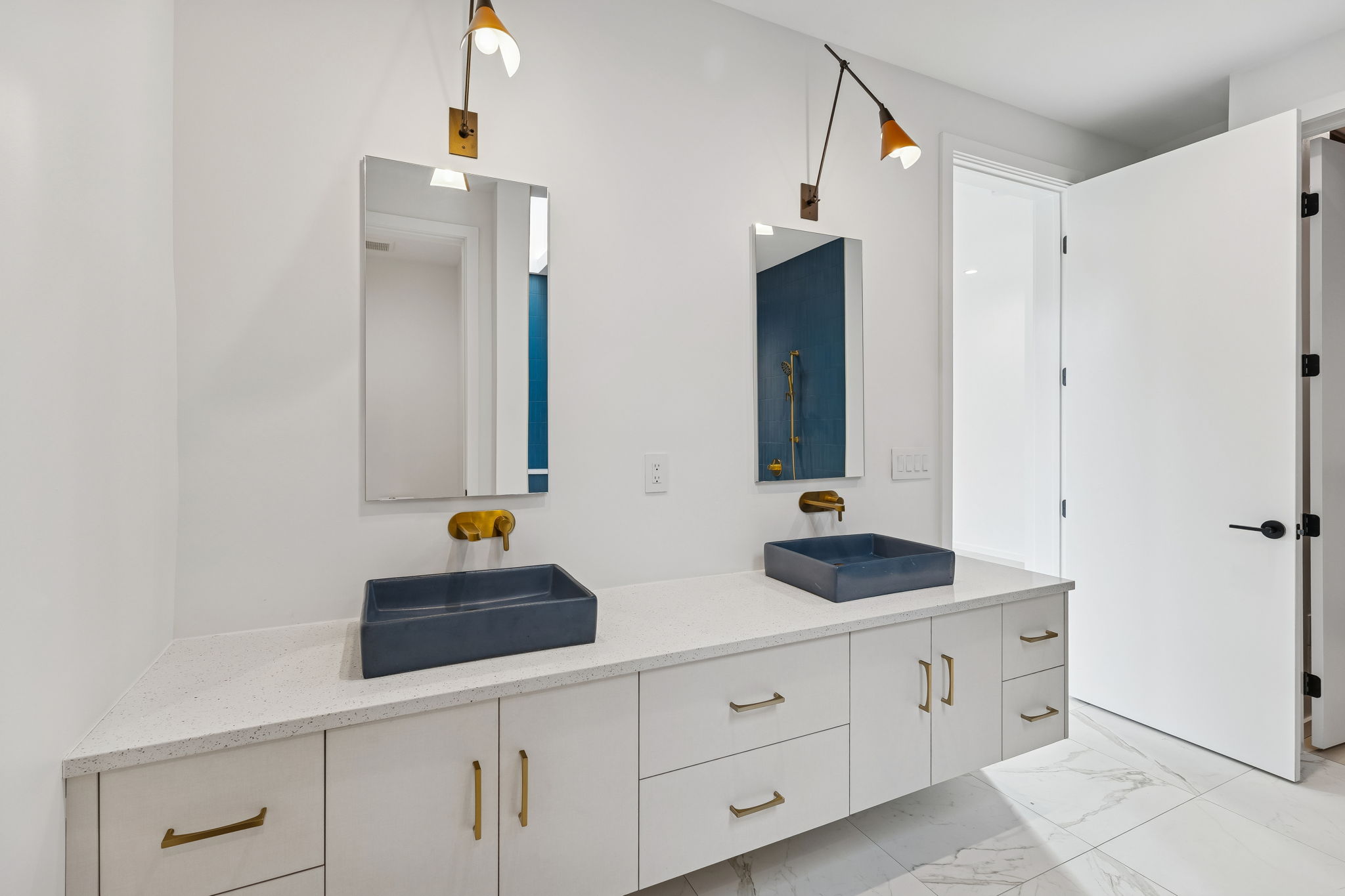 3007 Locke Lane Austin, TX 78704 - Photo 14 of 32 a bathroom with a double vanity sink and a mirror