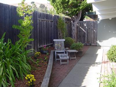 706 Del Ganado Road San Rafael, CA 94903 - Photo 6 of 9 a view of a chair and table in backyard