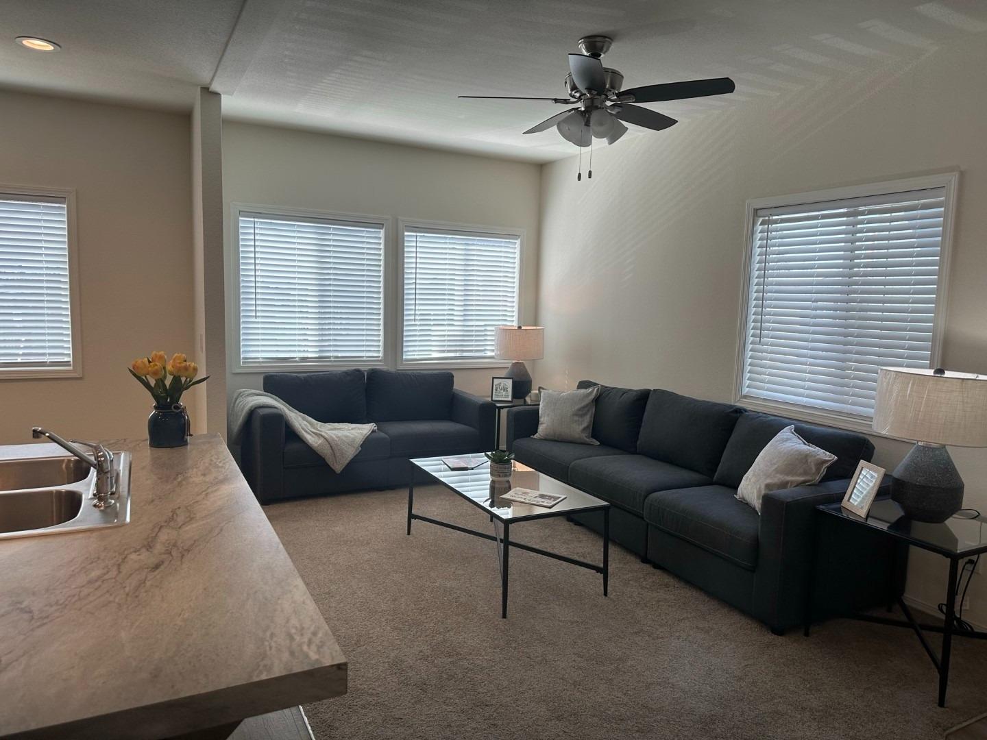 5812 Cedars Road, Unit 3 Redding, CA 96001 - Photo 4 of 14 a living room with furniture ceiling fan and a window