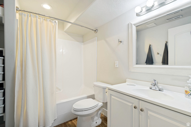983 West 1550th Street South Springville, UT 84663 - Photo 36 of 43 Bright bathroom featuring a white vanity with integrated sink, a framed mirror, and a full bathtub with shower surround