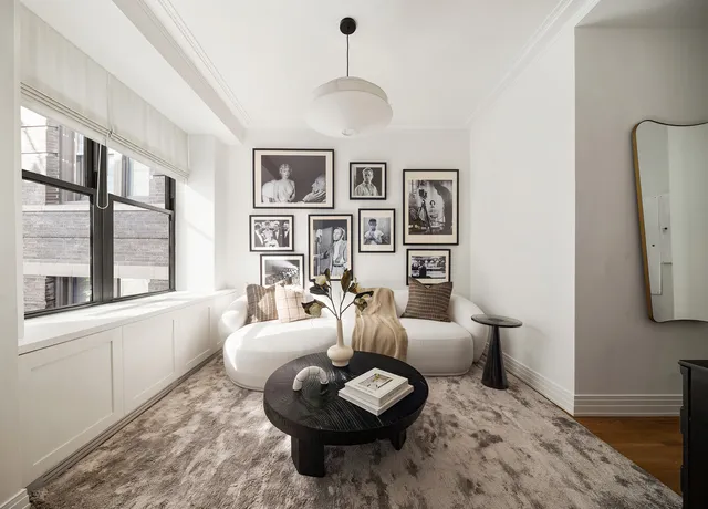 a view of a workspace room with furniture and wooden floor