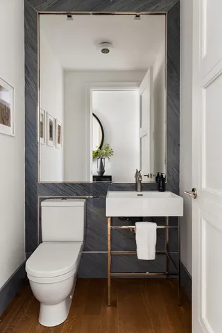 a living room with furniture a rug and a window