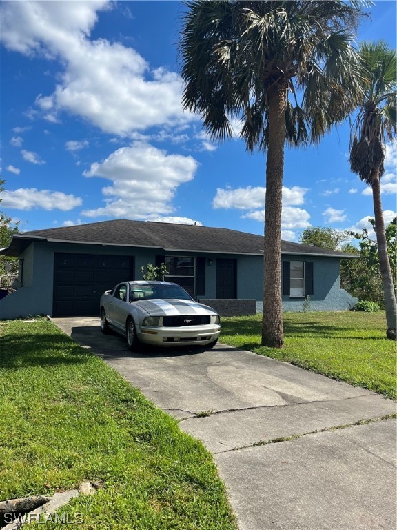 2202 Lily Road Fort Myers, FL 33905 - Photo 1 of 7 a car parked in front of a house and a yard