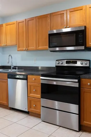 a kitchen with a stove and a microwave
