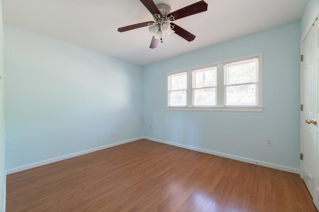 342 Mathews Avenue Northeast, Unit A Atlanta, GA 30307 - Photo 12 of 34 an empty room with a window and a fan