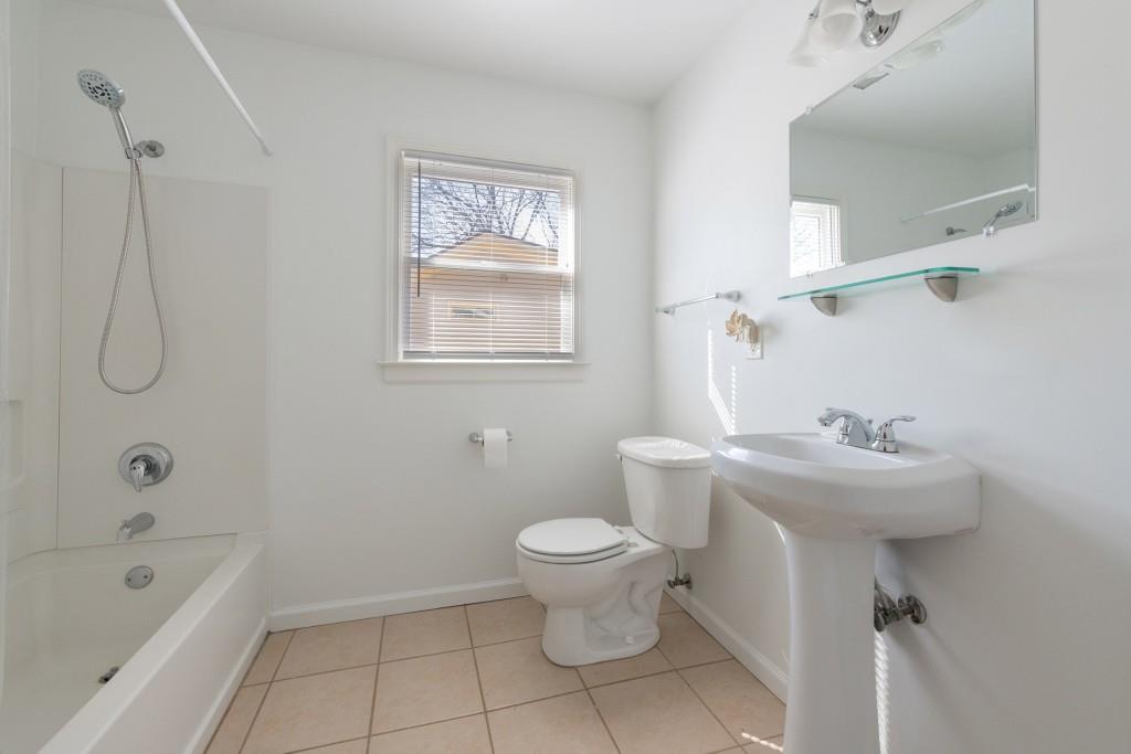 342 Mathews Avenue Northeast, Unit A Atlanta, GA 30307 - Photo 23 of 34 a bathroom with a sink toilet and shower