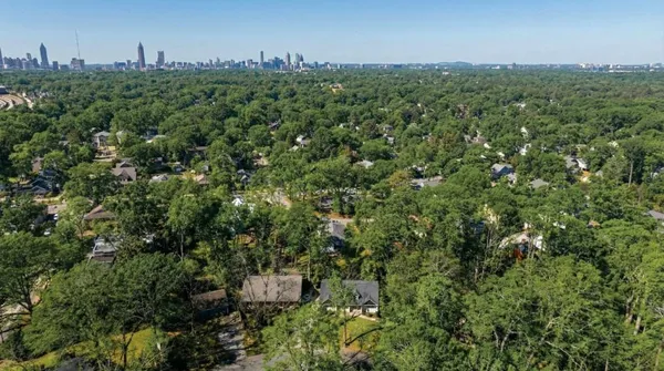 an aerial view of a houses with a yard