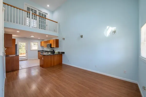 a view of kitchen with cabinets and wooden floor