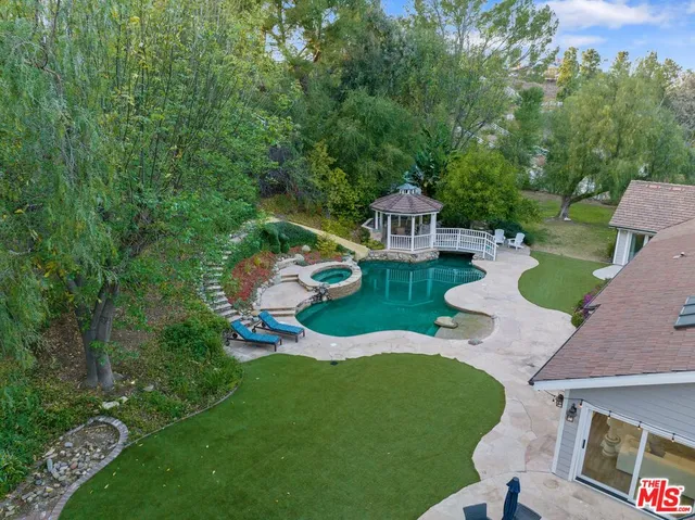 an aerial view of house with yard