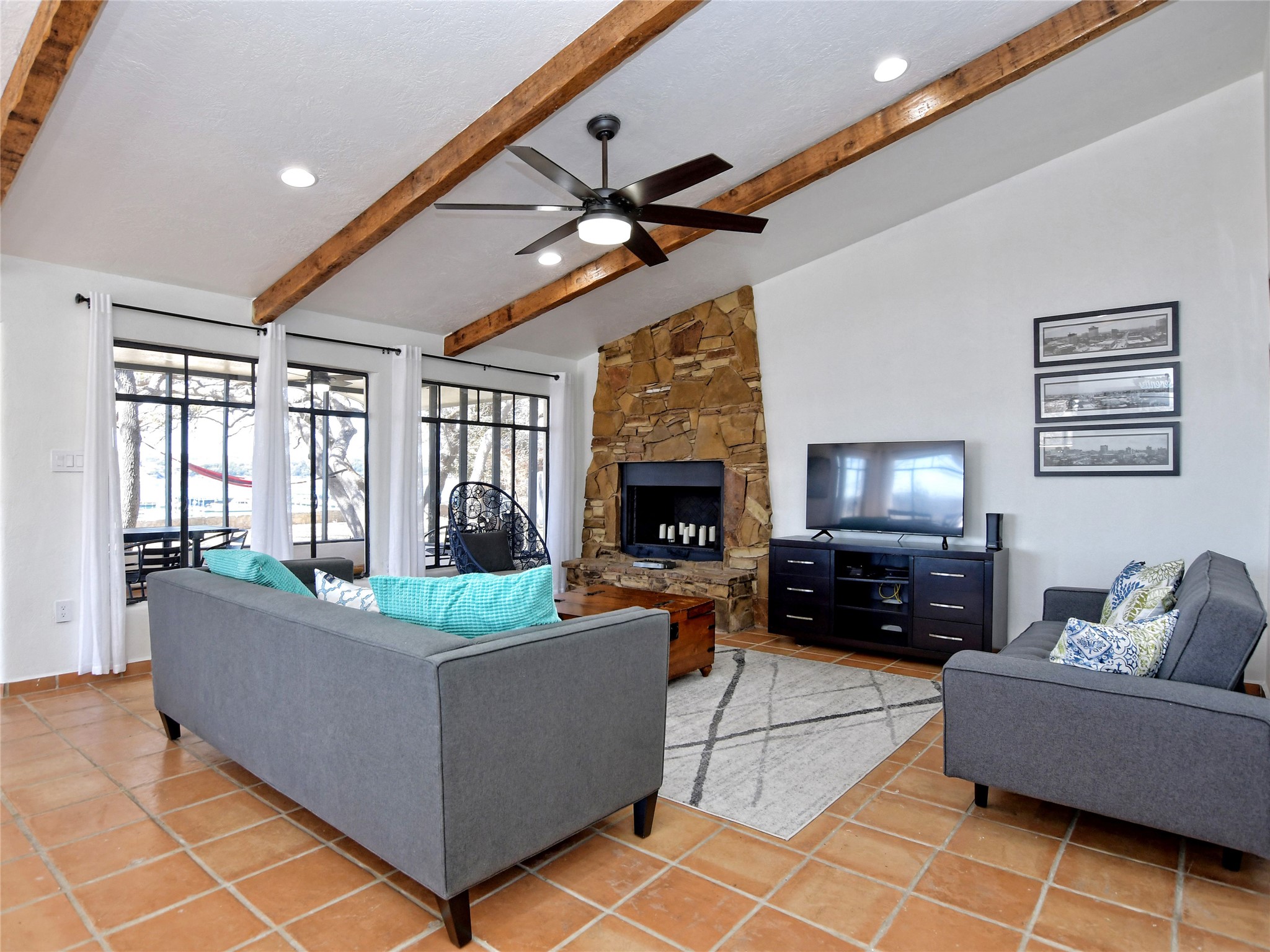 17123 Rocky Ridge Road Austin, TX 78734 - Photo 11 of 26 Vaulted ceiling living space featuring exposed wood beams, recessed lighting, and a ceiling fan