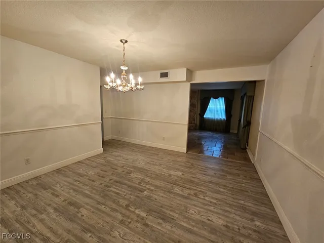 a kitchen with stainless steel appliances kitchen island granite countertop a sink and cabinets