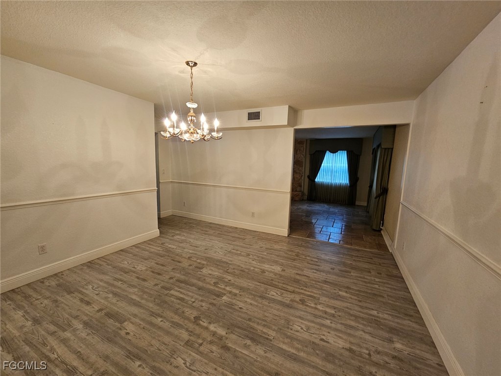3680 Fort Denaud Road LaBelle, FL 33935 - Photo 12 of 49 a view of a room with wooden floor