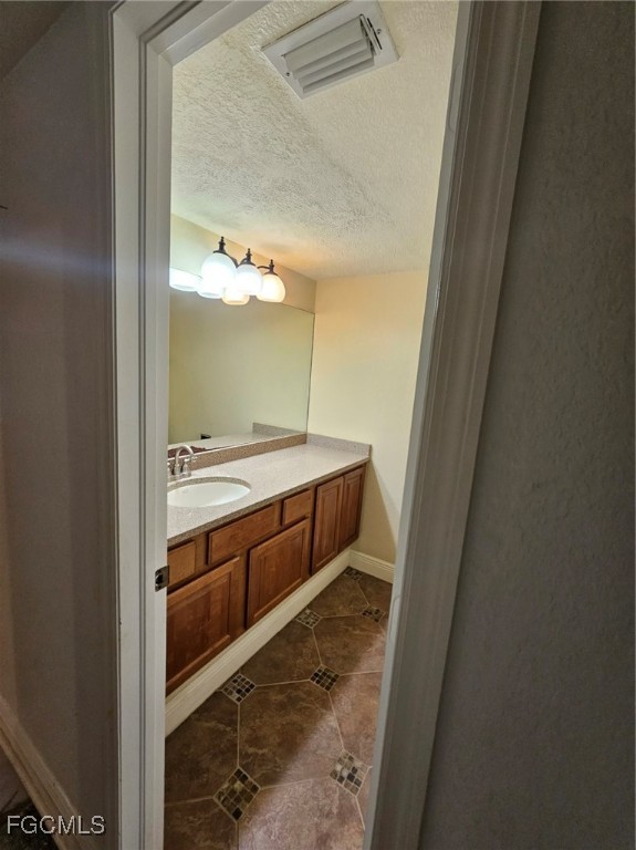3680 Fort Denaud Road LaBelle, FL 33935 - Photo 22 of 49 a bathroom with a double vanity sink and mirror