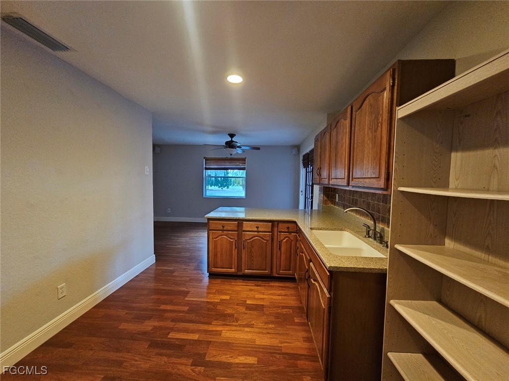 3680 Fort Denaud Road LaBelle, FL 33935 - Photo 26 of 49 a kitchen with granite countertop a sink and a stove top oven