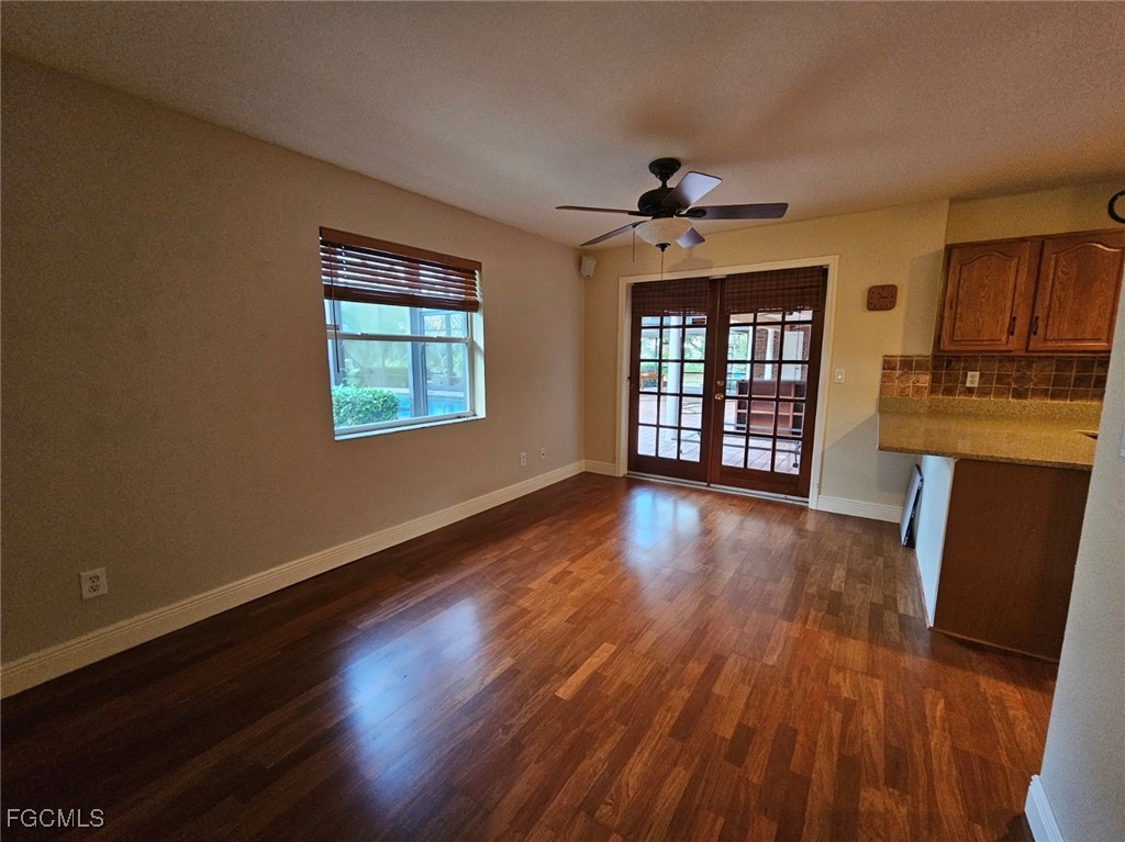 3680 Fort Denaud Road LaBelle, FL 33935 - Photo 27 of 49 a view of an empty room with window and wooden floor