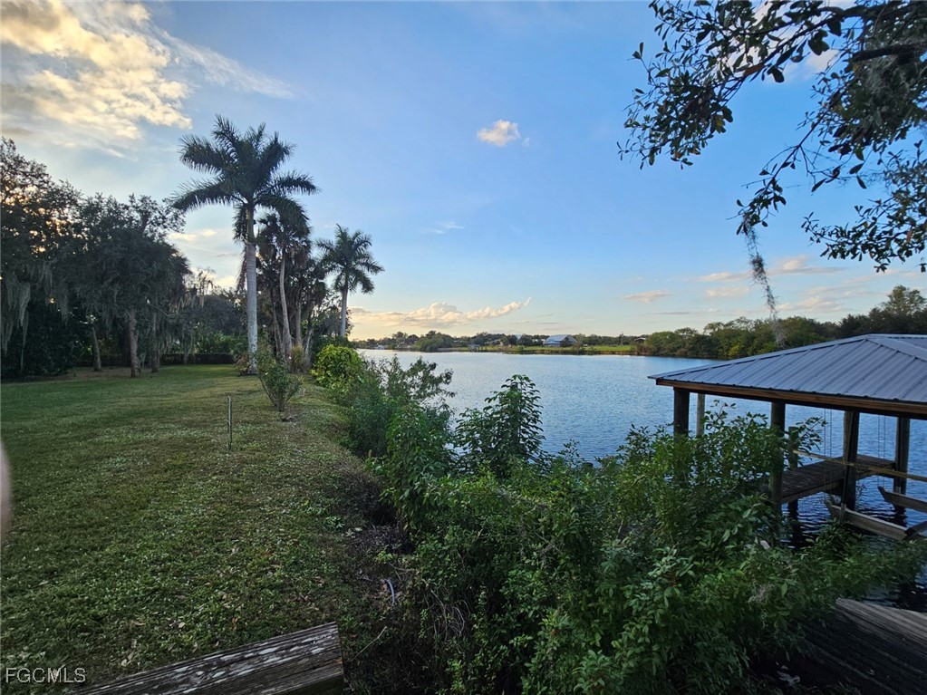 3680 Fort Denaud Road LaBelle, FL 33935 - Photo 47 of 49 a view of a lake with a garden