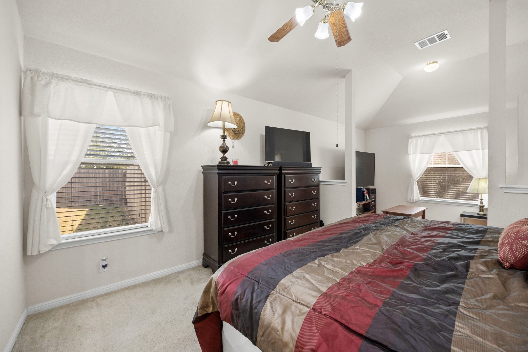 901 Kenneys Way Round Rock, TX 78665 - Photo 20 of 33 Carpeted bedroom with ceiling fan and lofted ceiling