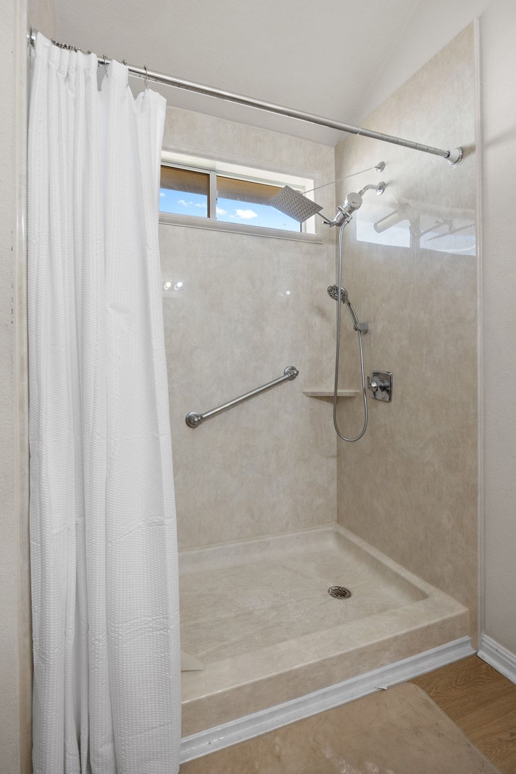 901 Kenneys Way Round Rock, TX 78665 - Photo 22 of 33 Bathroom with a stall shower and wood finished floors