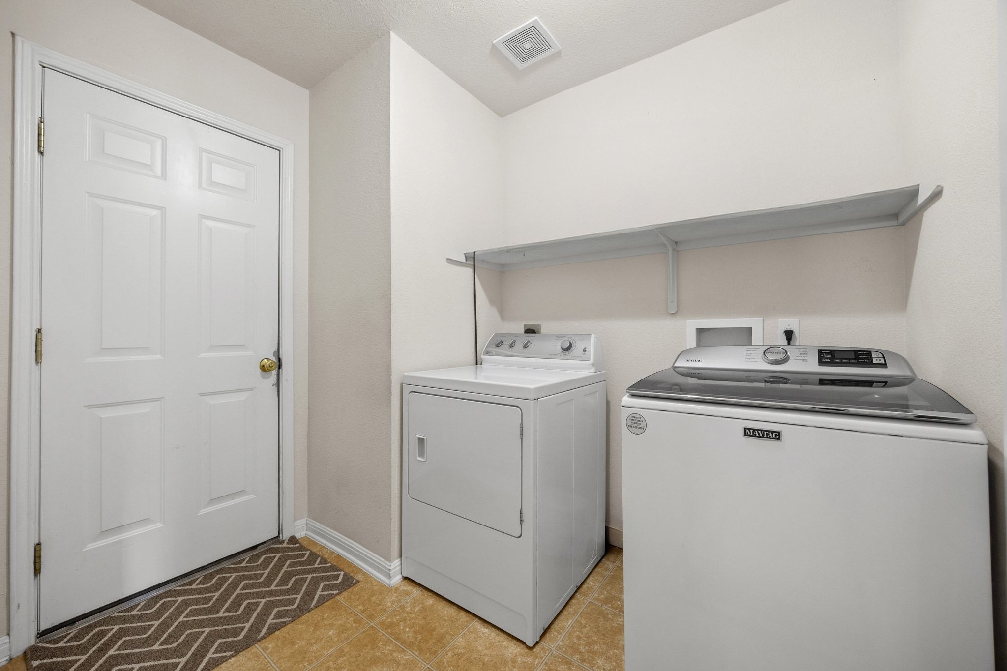 901 Kenneys Way Round Rock, TX 78665 - Photo 28 of 33 Laundry room featuring light tile patterned flooring and washing machine and dryer