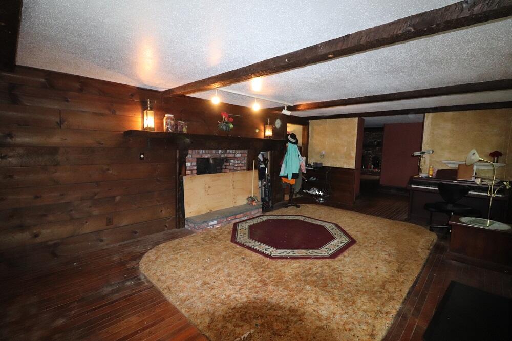 930 Old Bass River Road Dennis, MA 02638 - Photo 16 of 34 a room with wooden floor and large mirror