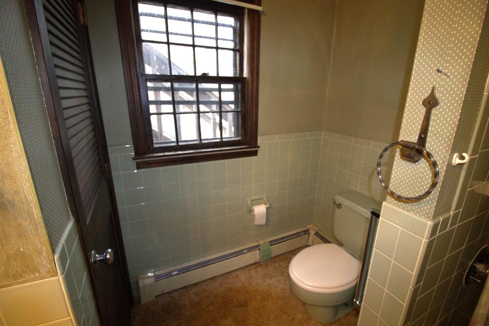 930 Old Bass River Road Dennis, MA 02638 - Photo 20 of 34 a bathroom with a toilet and a sink